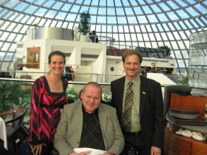 Sara Feldman (left) and Jeff Deitch (right) pose with Gudjon Sigurdsson (center) during their travel to Iceland.